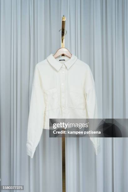 elegant white shirt display | wardrobe essential - shirt tag stock pictures, royalty-free photos & images