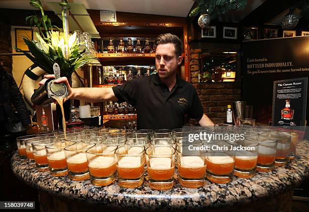 Bartender prepares Jack Daniels Single Barrel, 'Curtain Raiser' cocktails at the pre drinks for The Old Vic's 24 Hour Musicals Celebrity Gala 2012 at...