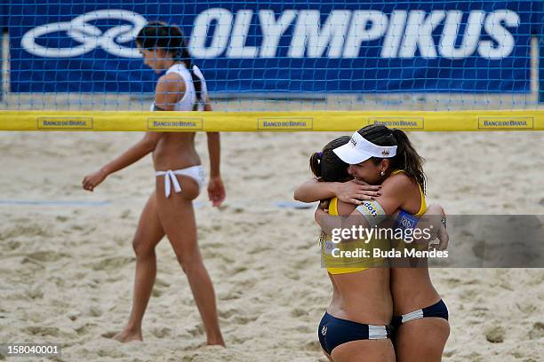 Rebecca and Lili celebrates a victory during a beach volleyball match against the 6th stage of the season 2012/2013 Circuit Bank of Brazil at...
