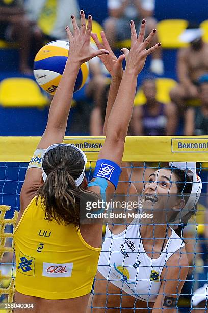Lili and Carolina in action during a beach volleyball match against the 6th stage of the season 2012/2013 Circuit Bank of Brazil at Copacabana Beach...