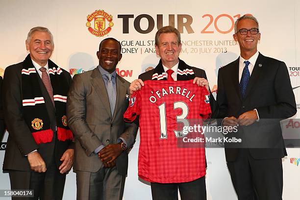 George Souris MP, Dwight Yorke, NSW Premier Barry O'Farrell and FFA CEO David Gallop pose after a press conference at Museum of Contemporary Art on...