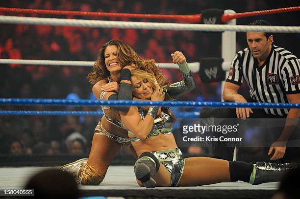 Superstars WWE Dive Eve Torres and WWE Diva Layla wrestle during 10th anniversary of WWE Tribute to the Troops at Norfolk Scope Arena on December 9,...