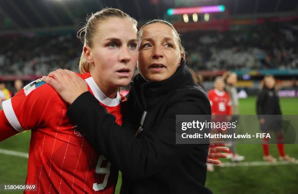 Ana-Maria Crnogorcevic of Switzerland and Inka Grings, Head Coach of Switzerland, embrace after the FIFA Women's World Cup Australia & New Zealand...