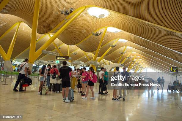 Several passengers in the check-in area of Terminal 4 at Adolfo Suarez Madrid-Barajas Airport, on August 1 in Madrid, Spain. Aena's airport network...