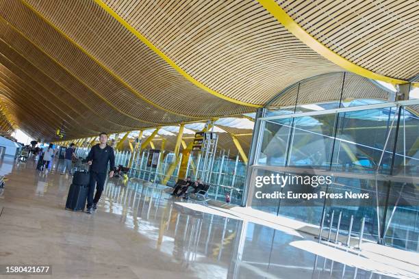 Passenger walks to the boarding gate of his flight at Terminal 4 of the Adolfo Suarez Madrid-Barajas Airport, on August 1 in Madrid, Spain. Aena's...