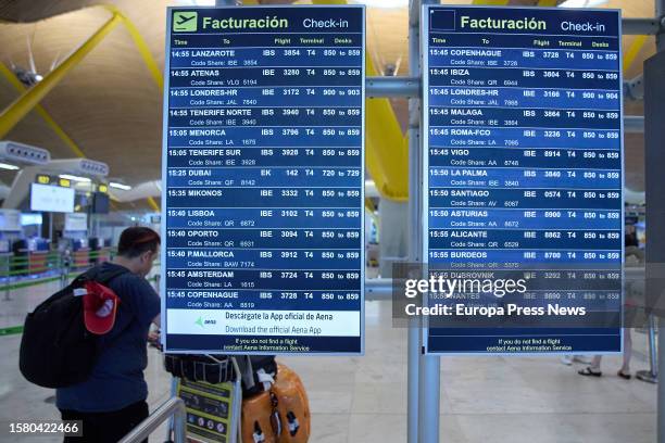 Information panel for flight departures in the check-in area of Terminal 4 at Adolfo Suarez Madrid-Barajas Airport, on August 1 in Madrid, Spain....