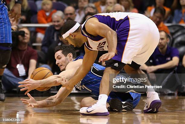 Redick of the Orlando Magic and Jared Dudley of the Phoenix Suns battle for a loose ball during the NBA game at US Airways Center on December 9, 2012...