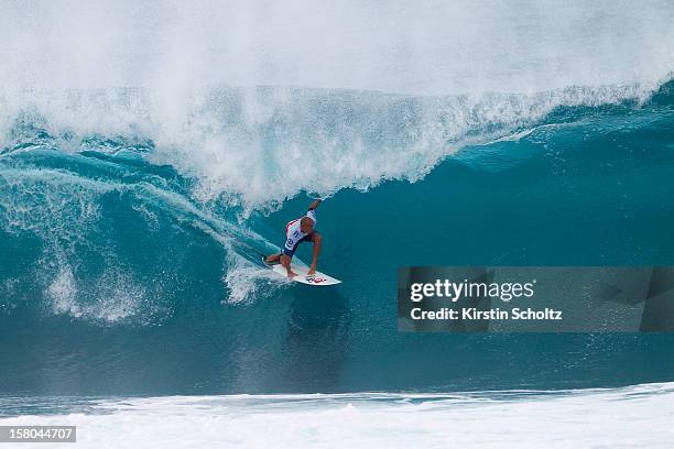 Kelly Slater of the United States of America surfs into round four during the Billabong Pipe Masters on December 9, 2012 in North Shore, Hawaii.