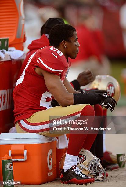 Darcel McBath of the San Francisco 49ers sitting on a Gatorade ice chest, looks on from the sidelines against the Miami Dolphins in the third quarter...