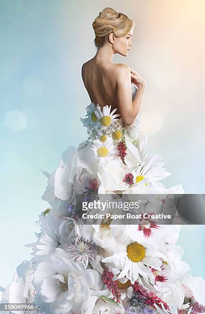 woman wearing a wedding dress made of white flower - evening gown stock-fotos und bilder