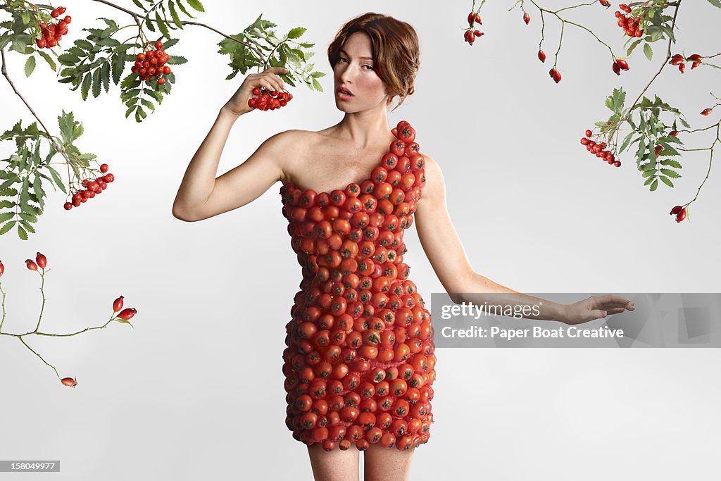 Woman wearing a red dress made of berries