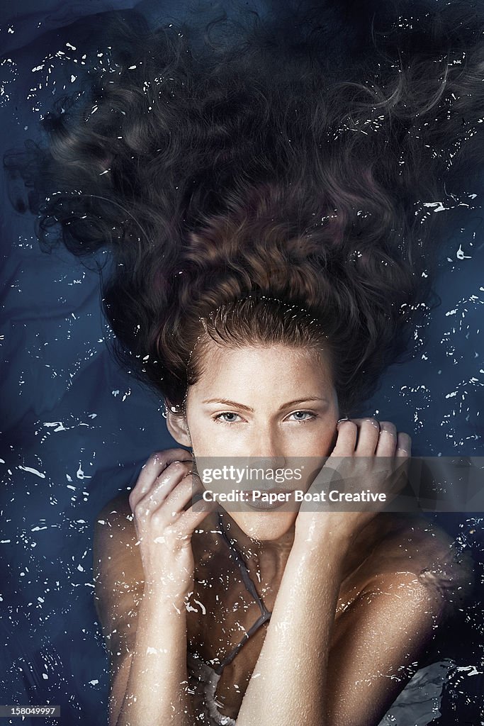 Woman Floating In Pool Woman Floating In A Swimming Pool High-Res Stock Photo - Getty Images