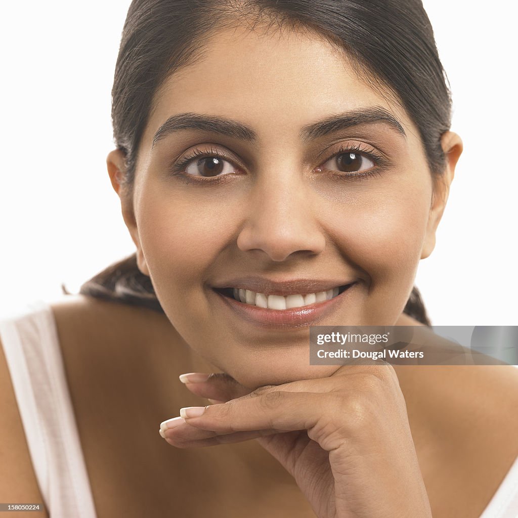 Indian woman smiling.