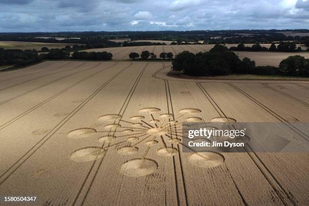 An aerial view of a geometric crop circle, measuring approximately 70 metres, in a field of wheat in Hampshire on July 29, 2023 near Andover,...