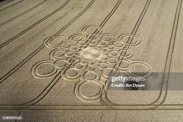 An aerial view of a geometric crop circle, measuring approximately 100 metres, in a field of wheat in Hampshire on July 29, 2023 near Winchester,...