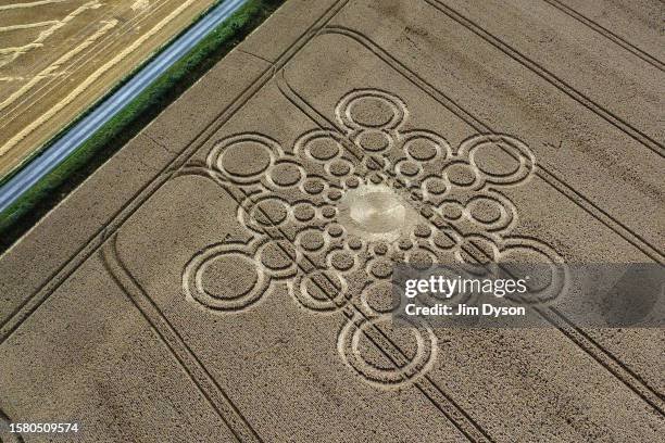 An aerial view of a geometric crop circle, measuring approximately 100 metres, in a field of wheat in Hampshire on July 29, 2023 near Winchester,...