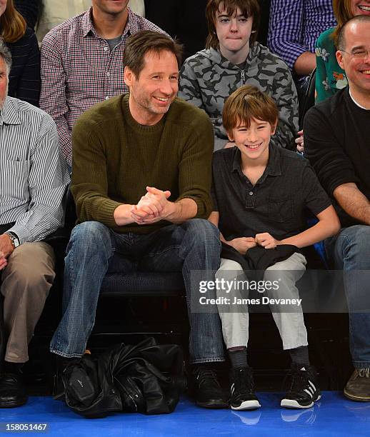 David Duchovny and Kyd Miller Duchovny attend the Denver Nuggets vs New York Knicks game at Madison Square Garden on December 9, 2012 in New York...
