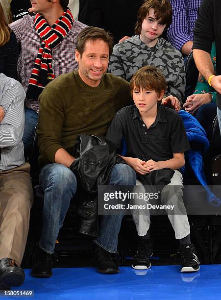 David Duchovny and Kyd Miller Duchovny attend the Denver Nuggets vs New York Knicks game at Madison Square Garden on December 9, 2012 in New York...