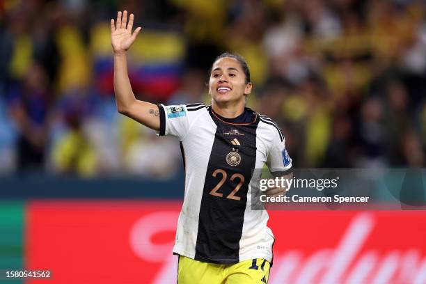 Carolina Arias of Colombia waves to fans following victory wearing the shirt of Jule Brand of Germany after exchanging jerseys after the FIFA Women's...