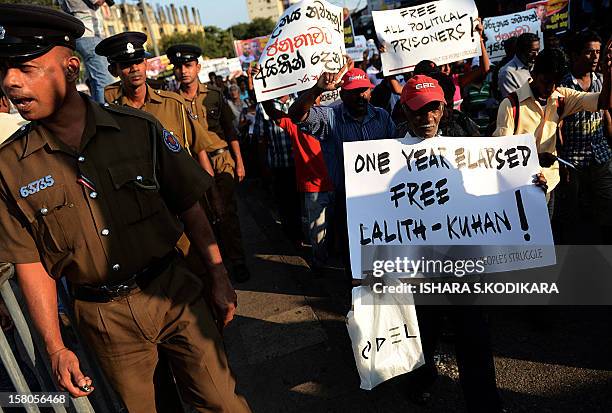 Activists of the Front Line Socialist Party demonstrate in Colombo on December 10, 2012 marking the first anniversary of the disappearance of their...