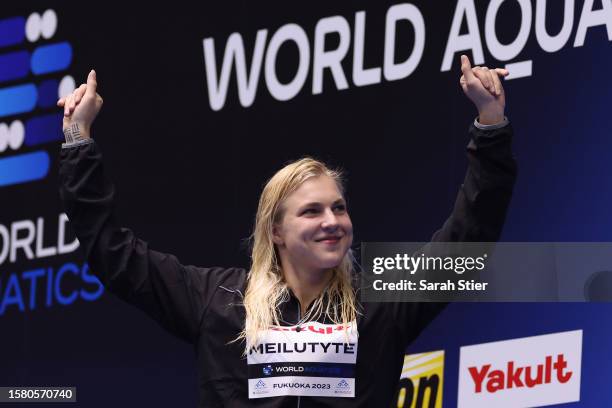 Gold medallist Ruta Meilutyte of Team Lithuania pose during the medal ceremony for Women's 50m Breaststroke Final on day eight of the Fukuoka 2023...