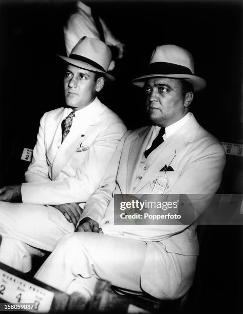 Edgar Hoover, head of the Federal Bureau of Investigaton, and his associate, Clyde Tolson at the Joe Louis and Jack Sharkey fight at Yankee Stadium,...