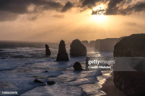 the iconic twelve apostles of the great ocean road, port campbell national park, victoria, australia - australian winter landscape stock-fotos und bilder