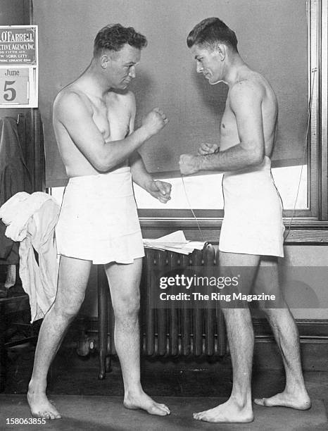 Gene Tunney poses with Tommy Gibbons before their fight at the Polo Grounds, on June 5,1925 in New York, New York. Gene Tunney won by a KO 12.