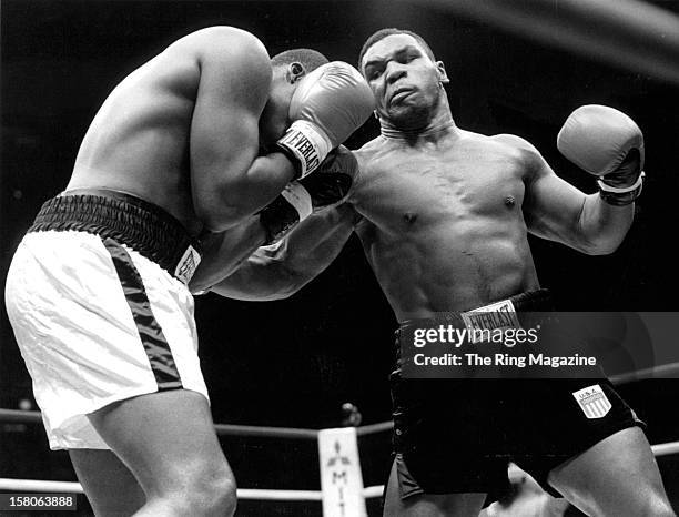 Mike Tyson throws a punch against Reggie Gross during the fight at the Madison Square Garden, on June 13,1986 in New York, New York. Mike Tyson won...