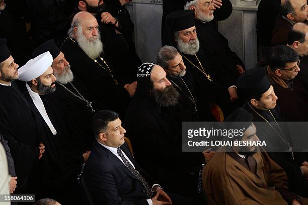 Christian and Muslim clerics attend the funeral of Greek Orthodox patriarch of Syria, Ignatius IV Hazim, at the Meriamiah Church in the Syrian...