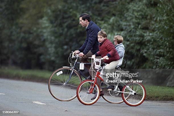 Prince Charles, Prince William And Prince Harry On Bikes Returning From The Stables, At Sandringham Estate, In Norfolk.