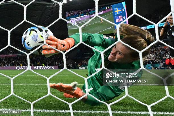 S goalkeeper Alyssa Naeher concedes the winning goal scored by Sweden's forward Lina Hurtig in the penalty shout-out during the Australia and New...