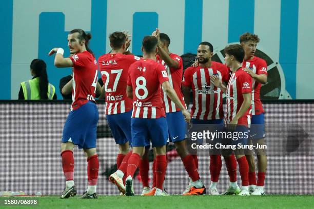 Memphis Depay of Atletico Madrid celebrates with teammates after scoring the team's first goal during the preseason friendly match between Atletico...