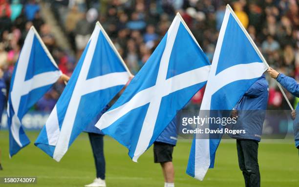 Flag bearers parade the Scottish Saltire prior to the Summer International match between Scotland and Italy at BT Murrayfield Stadium on July 29,...