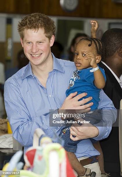 Prince Harry Visiting The Queen Elizabeth Ii Hospital In Bridgetown, Barbados, Visited The Children'S Ward And Met A Number Of Children.Seen Holding...