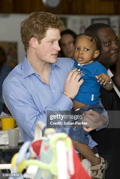 Prince Harry Visiting The Queen Elizabeth Ii Hospital In Bridgetown, Barbados, Visited The Children'S Ward And Met A Number Of Children.Seen Holding...