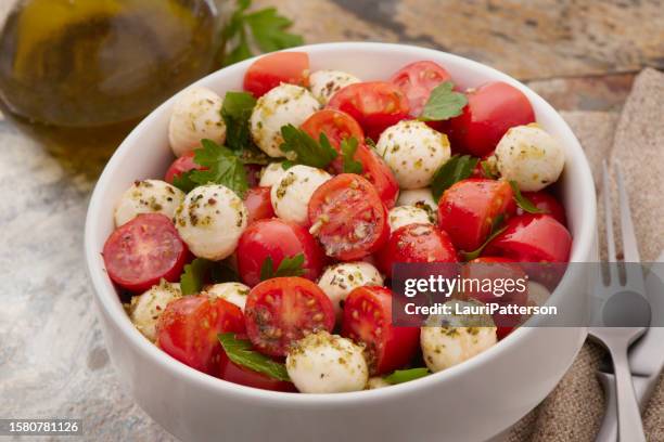 tomato and mozzarella salad - cherry tomato stock pictures, royalty-free photos & images