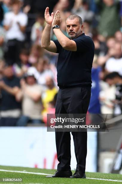 Tottenham Hotspur's Greek-Australian Head Coach Ange Postecoglou is introduced ahead of the pre-season friendly football match between Tottenham...