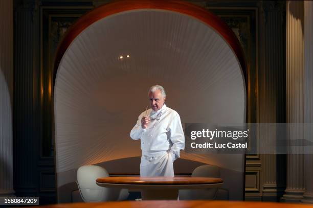 Alain Ducasse poses in his Restaurant at Plaza Athenee Hotel on March 16, 2015 in Paris, France.