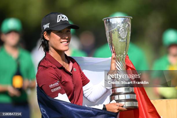 Celine Boutier of France celebrates with the Amundi Evian Championship trophy following victory in the Amundi Evian Championship at Evian Resort Golf...