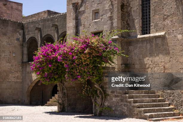 Quiet square at lunch time in the old town on July 30, 2023 in Rhodes, Greece. While Rhodes town itself wasn't directly affected by fire damage or...