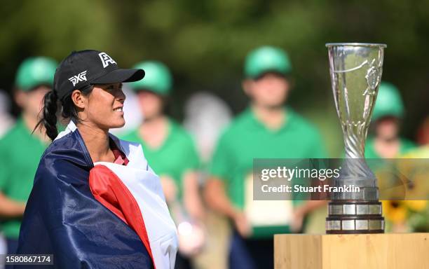 Celine Boutier of France poses alongside the Amundi Evian Championship trophy following victory in the Amundi Evian Championship at Evian Resort Golf...