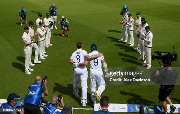 Stuart Broad of England embraces James Anderson as he walks through a guard of honour during Day Four of the LV= Insurance Ashes 5th Test Match...