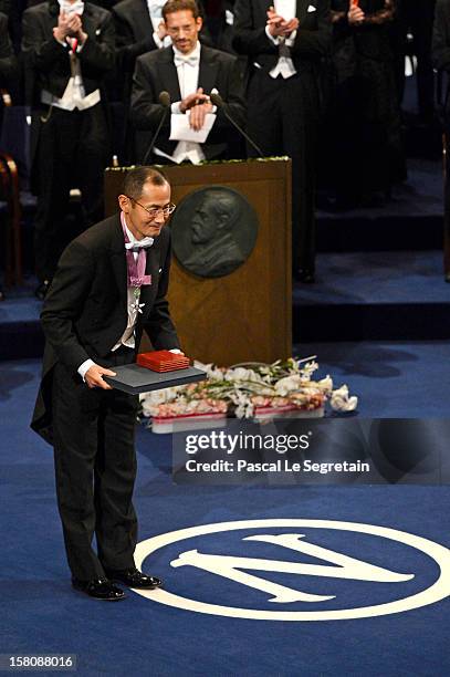 Nobel Laureate, Professor Shinya Yamanaka of Japan takes a bow after receiving the 2012 Nobel Prize for Medicine from King Carl XVI Gustaf of Sweden...