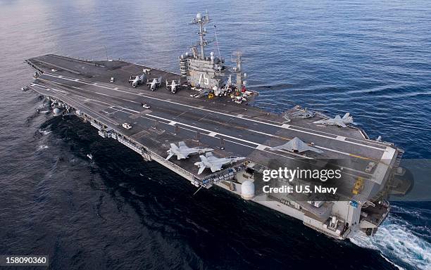 In this handout from the U.S. Navy, the X-47B Unmanned Combat Air System demonstrator taxies on the flight deck of the aircraft carrier USS Harry S....