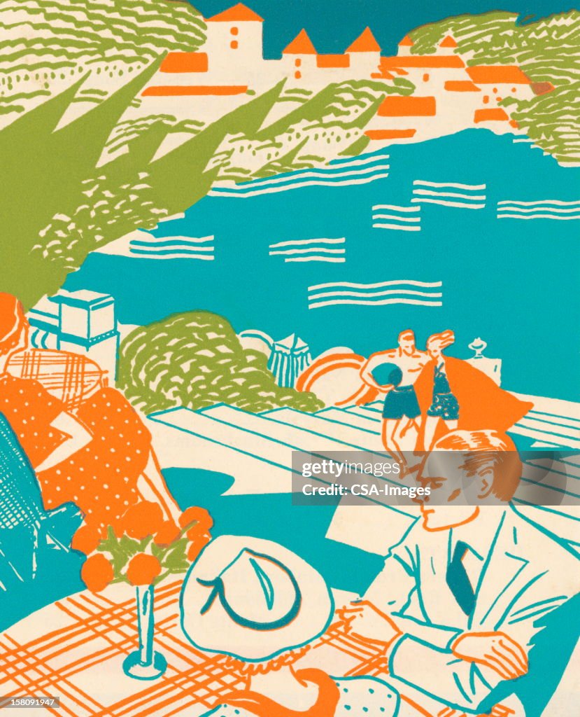 Glamourous Couple Sitting By Sea