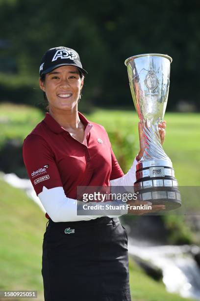 Celine Boutier of France celebrates with the Amundi Evian Championship trophy following victory in the Amundi Evian Championship at Evian Resort Golf...