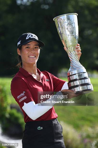 Celine Boutier of France celebrates with the Amundi Evian Championship trophy following victory in the Amundi Evian Championship at Evian Resort Golf...