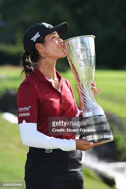 Celine Boutier of France kisses the Amundi Evian Championship trophy following victory in the Amundi Evian Championship at Evian Resort Golf Club on...