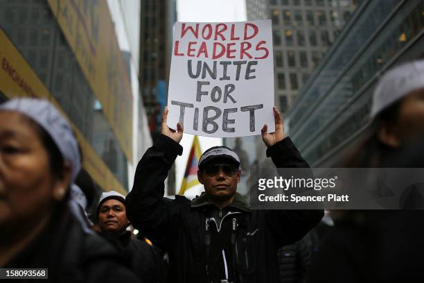 Protestors march down 42nd street to the United Nations General Assembly Building in recognition of International Human Rights Day on December 10,...